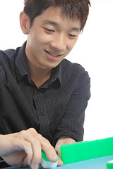 Image showing Chinese man play Mahjong, traditional China gamble. 