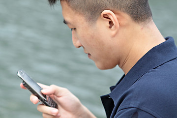 Image showing asia man talking on phone