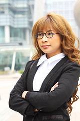 Image showing portrait of a young business woman in an office 