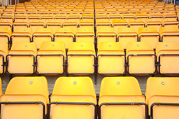Image showing Plenty of yellow plastic seats at stadium