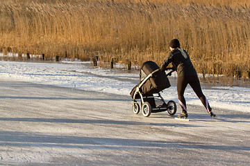 Image showing A woman is skating