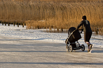 Image showing A woman is skating