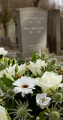 Image showing Flowers on a new grave