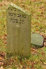 Image showing A broken gravestone