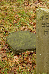 Image showing A broken gravestone