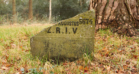 Image showing A broken gravestone