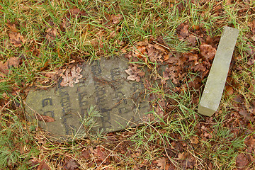 Image showing A broken gravestone