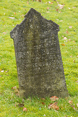 Image showing A tombstone on an old graveyard