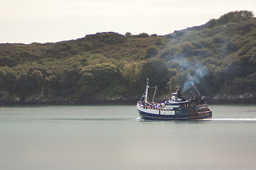 Image showing A fishingboat is leaving port