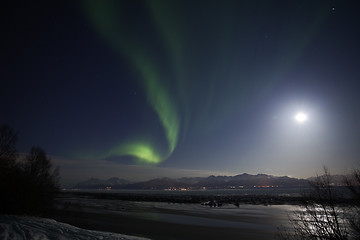 Image showing Active Aurora shines through Full Moon Light Over Cook Inlet and