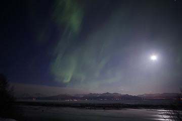 Image showing Active Aurora shines through Full Moon Light Over Cook Inlet and