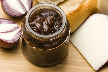 Image showing Onion jam in jar, goat's cheese and fresh bread