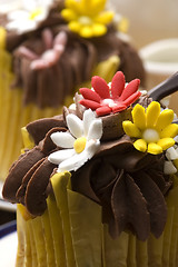 Image showing Spring muffins decorated with flower petals with tulips 