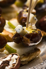 Image showing Appetizer Plate with Dactyl, Pecan nuts and Cheese