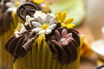 Image showing Spring muffins decorated with flower petals with tulips 