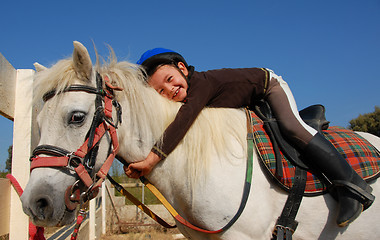 Image showing little girl and shetland pony