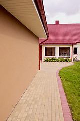 Image showing House with large windows and red tiled roof.