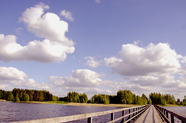 Image showing Long wooden footbridge. 