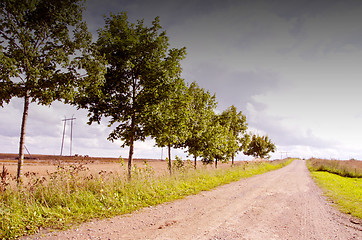 Image showing Rural gravel road. High voltage wire.