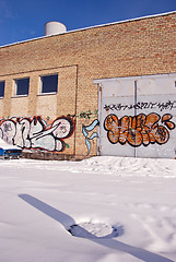 Image showing Graffiti on old white brick walls.