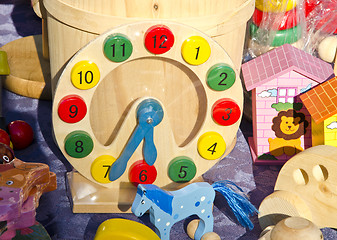 Image showing Playgrounds wooden toys Clock imitation horses 