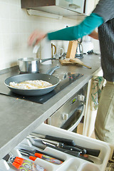 Image showing chef frying salmon steak