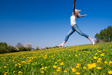 Image showing happy young woman on meadow