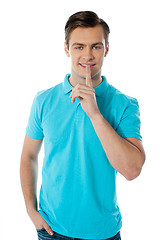 Image showing Silence gesture by a young guy wearing blue t-shirt