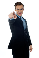 Image showing Smiling young professional pointing at you