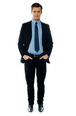 Image showing Young businessperson posing with hands in pocket