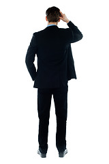 Image showing Back-pose of a corporate person standing