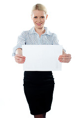 Image showing Corporate woman holding a blank billboard