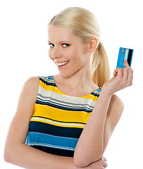 Image showing Blond salesgirl posing with credit card