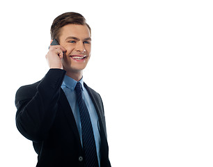 Image showing Adult handsome executive communicating on mobile