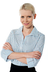 Image showing Glamourous female executive posing with folded arms