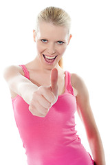 Image showing Pretty attractive girl showing thumbs-up