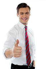 Image showing Business executive with thumbs up gesture