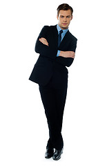 Image showing Handsome business executive tilting