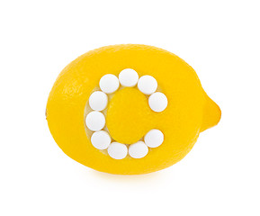 Image showing Lemon with vitamin c pills over white background 