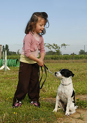 Image showing little girl and dog