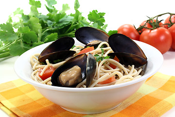 Image showing Spaghetti with mussels and parsley