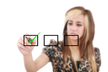 Image showing Young woman business hand with pen mark the check boxes. Hands o