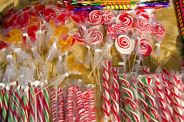 Image showing Various colorful suck lollipop sold market sweets 