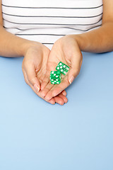 Image showing Holding dice