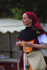 Image showing Portrait of a female troubadour on stilts