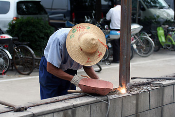 Image showing Chinese worker