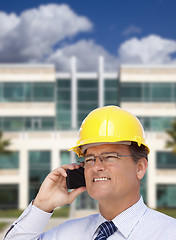 Image showing Contractor in Hardhat Talks on Phone In Front of Building