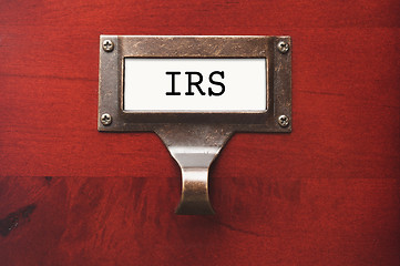 Image showing Lustrous Wooden Cabinet with I.R.S. File Label