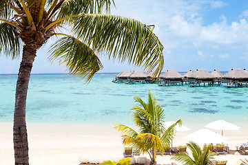 Image showing overwater bungalows in the lagoon