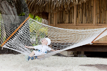 Image showing adorable toddler in a hammock